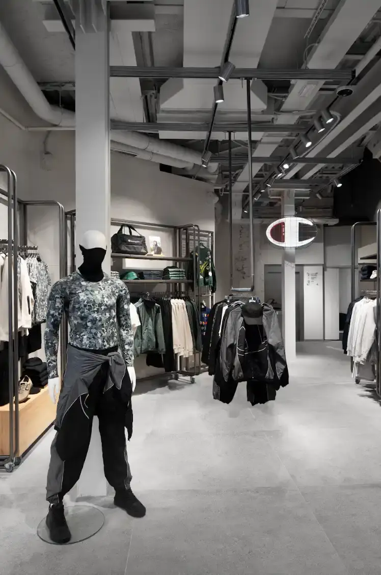 CHAMPION OPENS MILAN FLAGSHIP STORE Article about Champion's new Milan flagship store opening on Via Torino 19, with details on store layout, design concept, and community initiatives. (image 3 of 5)