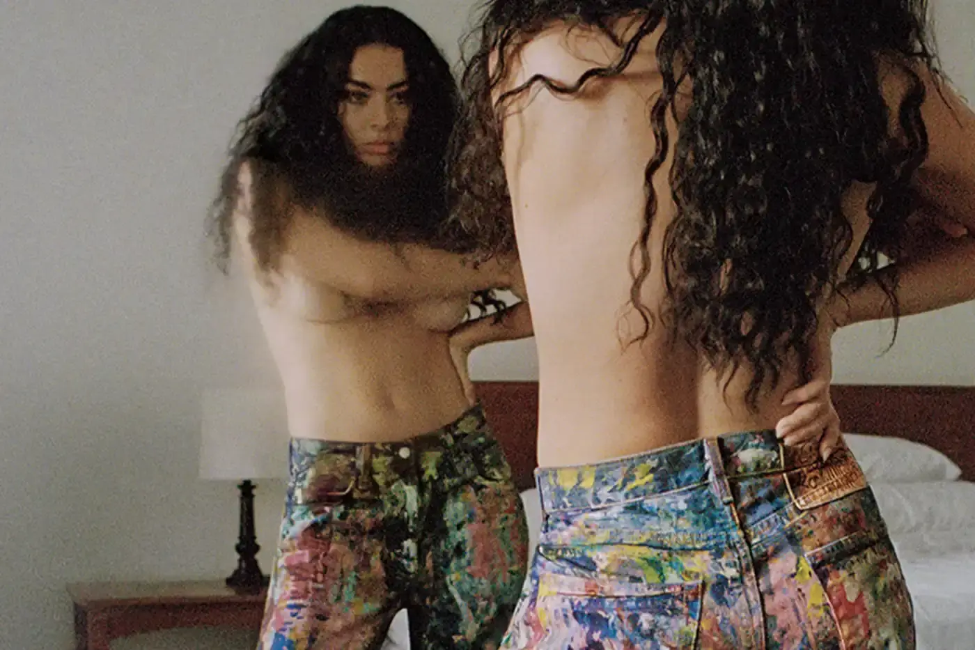 Talia Chetrit/Acne Studios The Acne Studios Spring/Summer 2025 campaign features singer-songwriter Charli XCX wearing key pieces from the collection, including coated iridescent and painted trompe-l'oeil denim styles, as well as the new season's Multipocket and Bowlina bags. The collaboration highlights Charli XCX's longstanding relationship with the brand and her ability to seamlessly blend underground and mainstream influences. (image 6 of 8)
