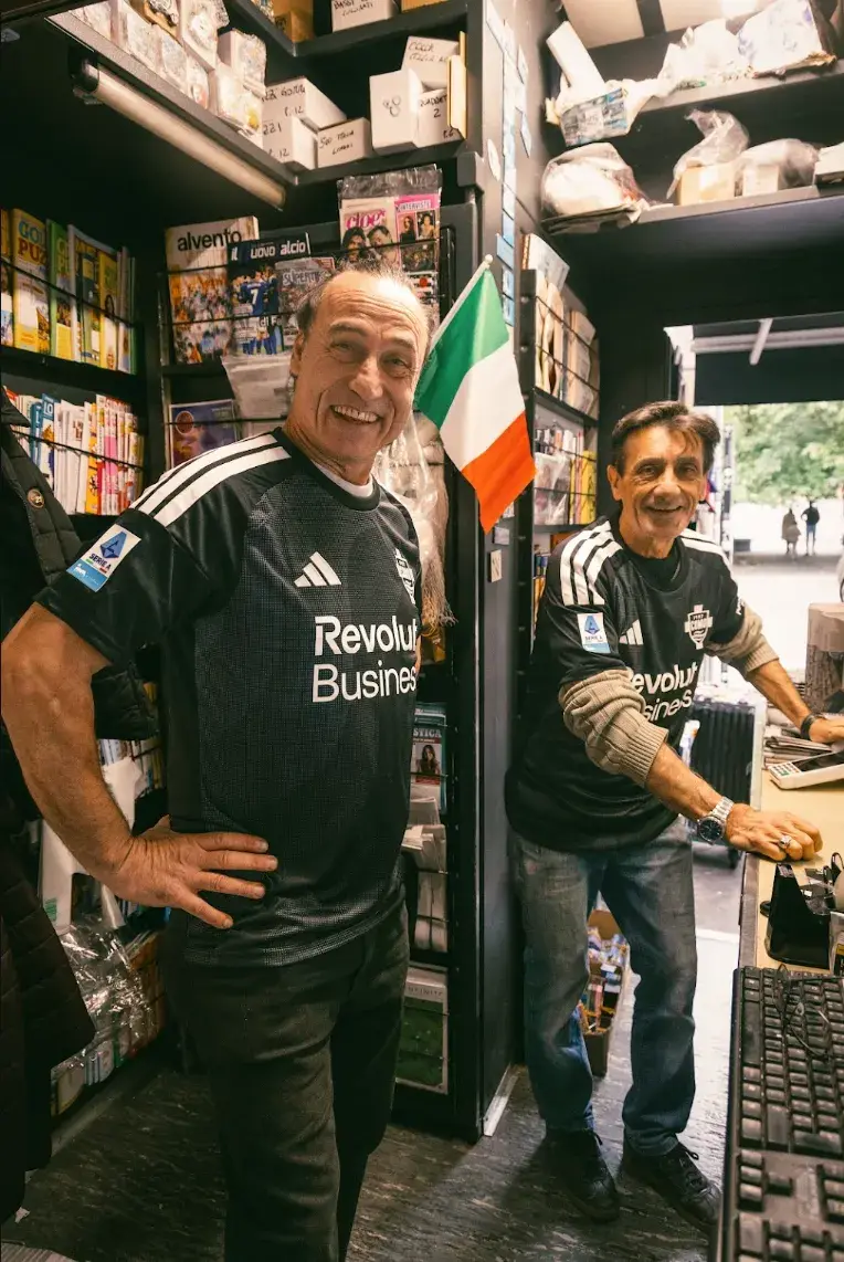 BY THE PEOPLE, FOR THE PEOPLE: COMO 2026-27 THIRD KIT image of Black Como 1907 third shirt for 2026-27 by Adidas, with wavy dark grey and charcoal bands across the front, white logos and Revolut branding in the centre.