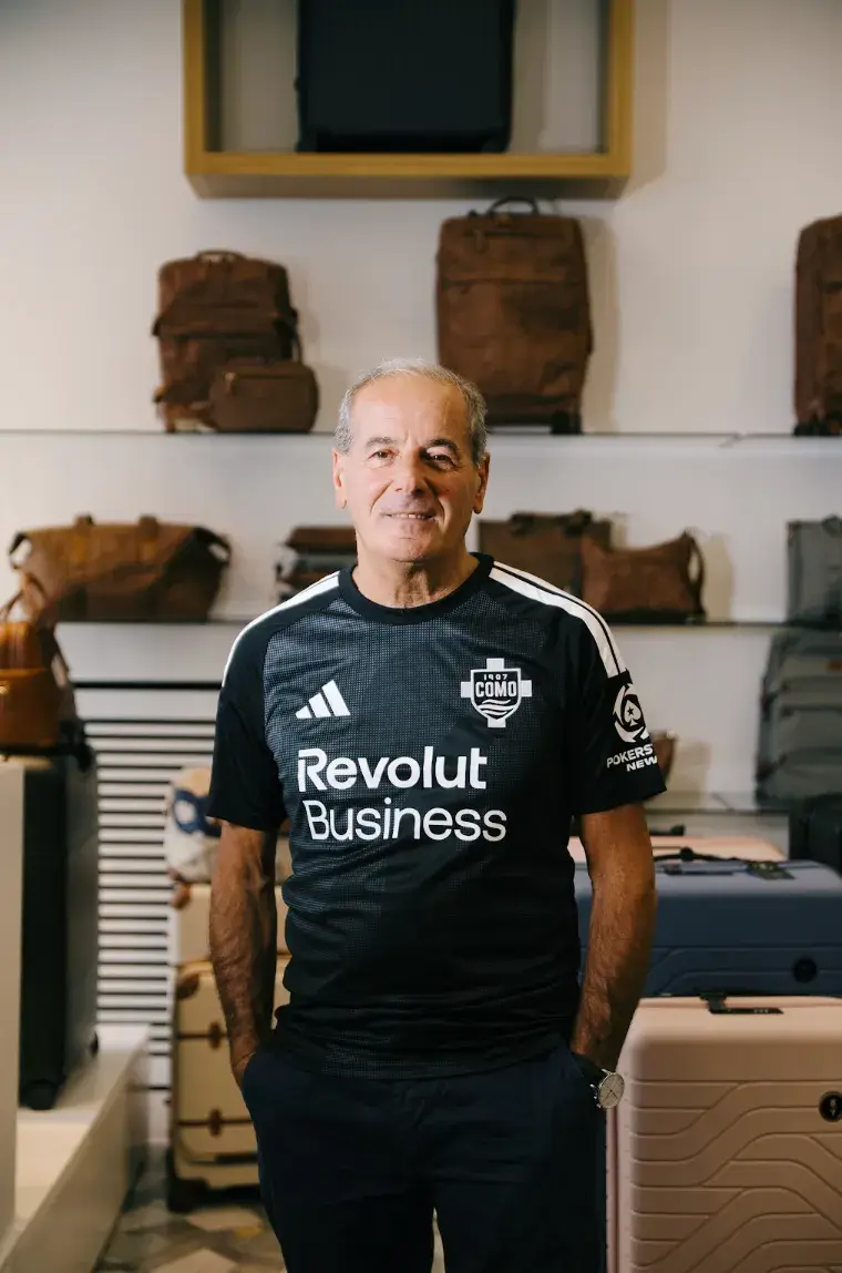 BY THE PEOPLE, FOR THE PEOPLE: COMO 2026-27 THIRD KIT image of Black Como 1907 third shirt for 2026-27 by Adidas, with wavy dark grey and charcoal bands across the front, white logos and Revolut branding in the centre. (image 8 of 9)