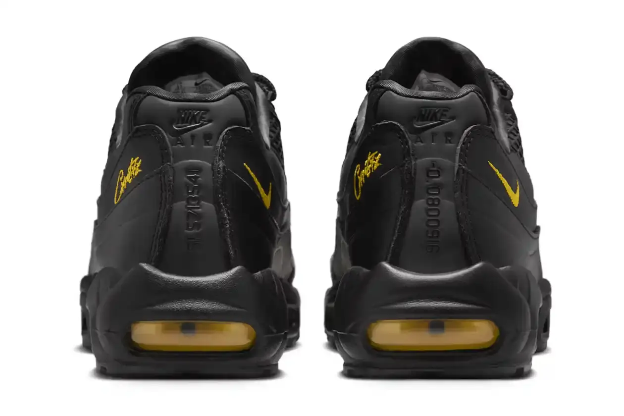 Nike Corteiz x Nike Air Max 95 'Honey Black' sneaker featuring an all-black premium leather upper with contrasting Tour Yellow accents on the branding and Air cushioning units. The sleek design showcases Corteiz branding on the lateral toe, heel, tongue and outsole, with London coordinates visible on the heel. The shoe maintains the Air Max 95's signature layered construction with mesh detailing on the upper. (image 6 of 8)