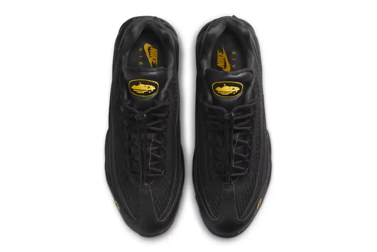 Nike Corteiz x Nike Air Max 95 'Honey Black' sneaker featuring an all-black premium leather upper with contrasting Tour Yellow accents on the branding and Air cushioning units. The sleek design showcases Corteiz branding on the lateral toe, heel, tongue and outsole, with London coordinates visible on the heel. The shoe maintains the Air Max 95's signature layered construction with mesh detailing on the upper. (image 5 of 8)