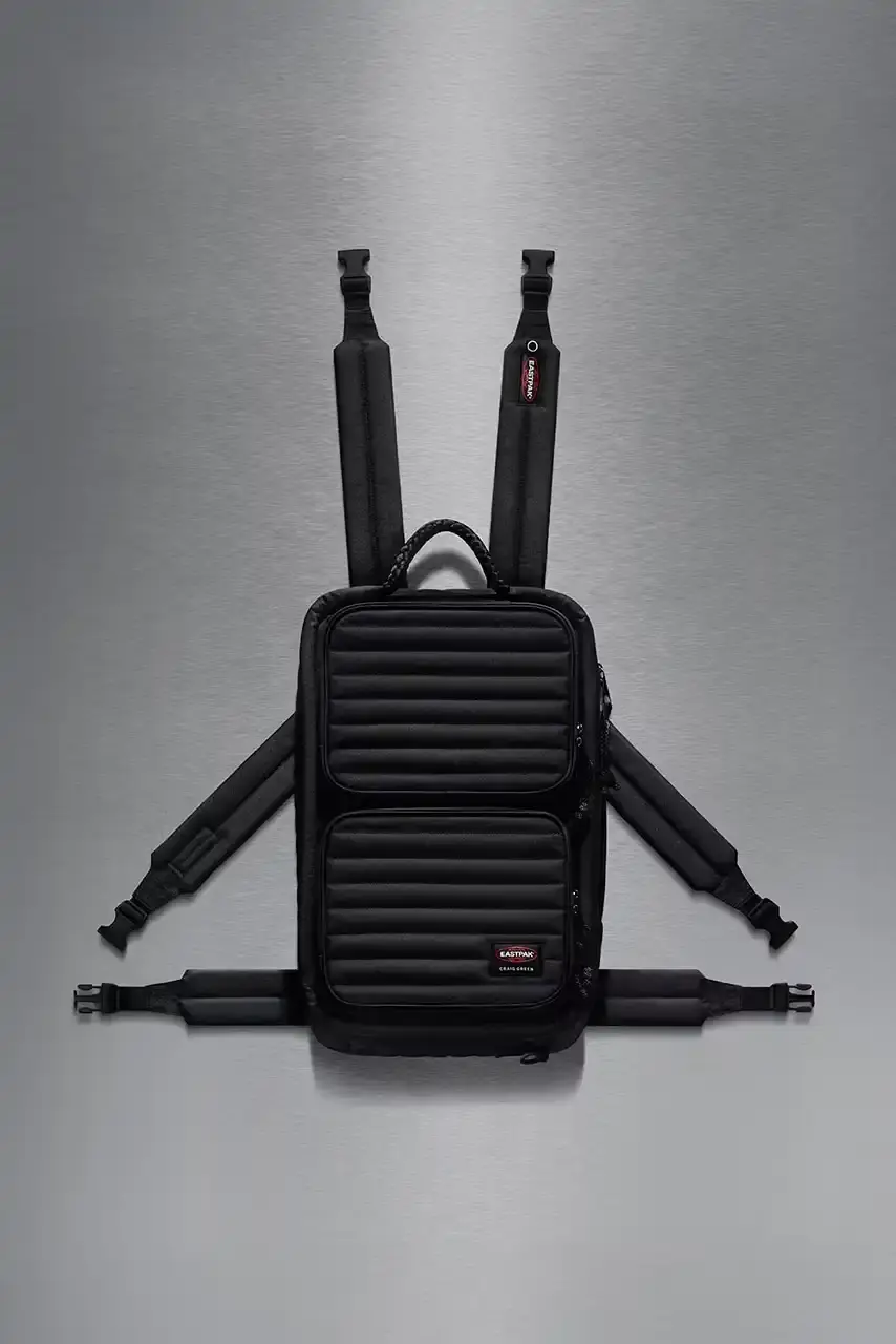 Eastpak Craig Green x Eastpak collection featuring quilted bags in black, khaki and navy with distinctive vertical stitching and modified logo patches. (image 5 of 7)