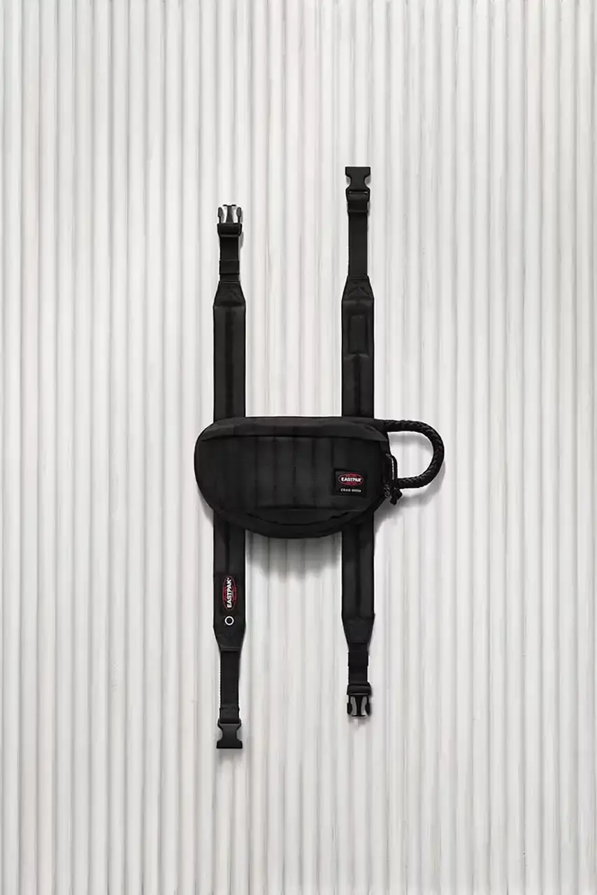 Eastpak Craig Green x Eastpak collection featuring quilted bags in black, khaki and navy with distinctive vertical stitching and modified logo patches. (image 7 of 7)