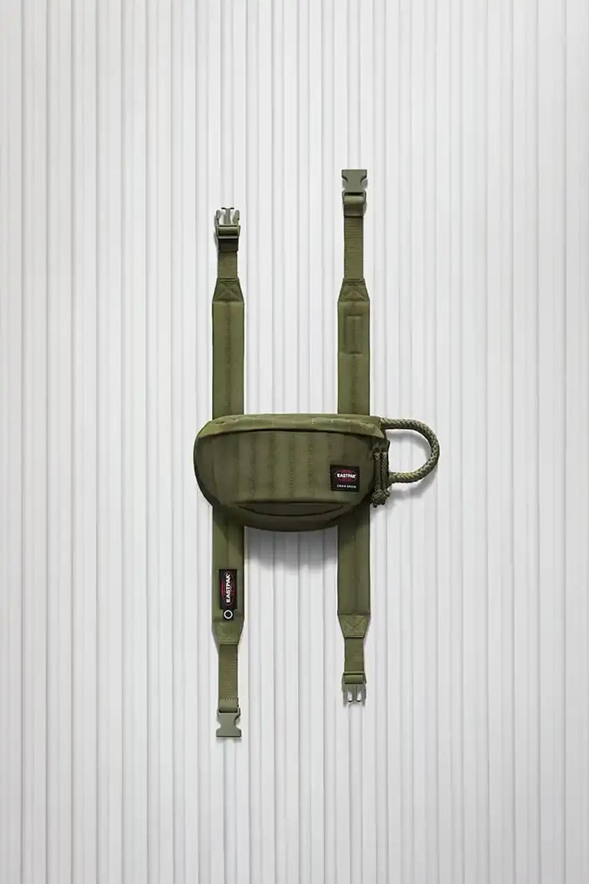 Eastpak Craig Green x Eastpak collection featuring quilted bags in black, khaki and navy with distinctive vertical stitching and modified logo patches. (image 6 of 7)
