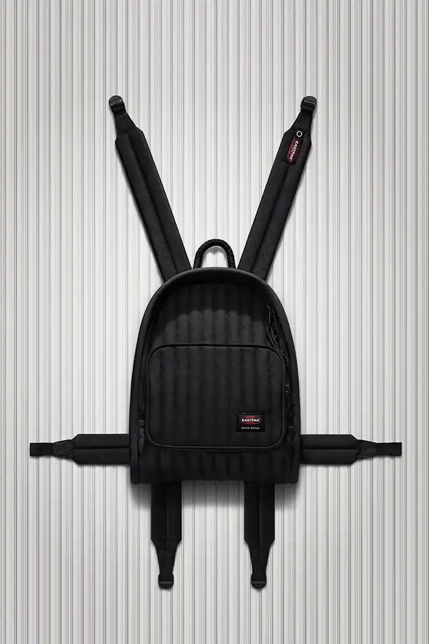 Eastpak Craig Green x Eastpak collection featuring quilted bags in black, khaki and navy with distinctive vertical stitching and modified logo patches. (image 2 of 7)