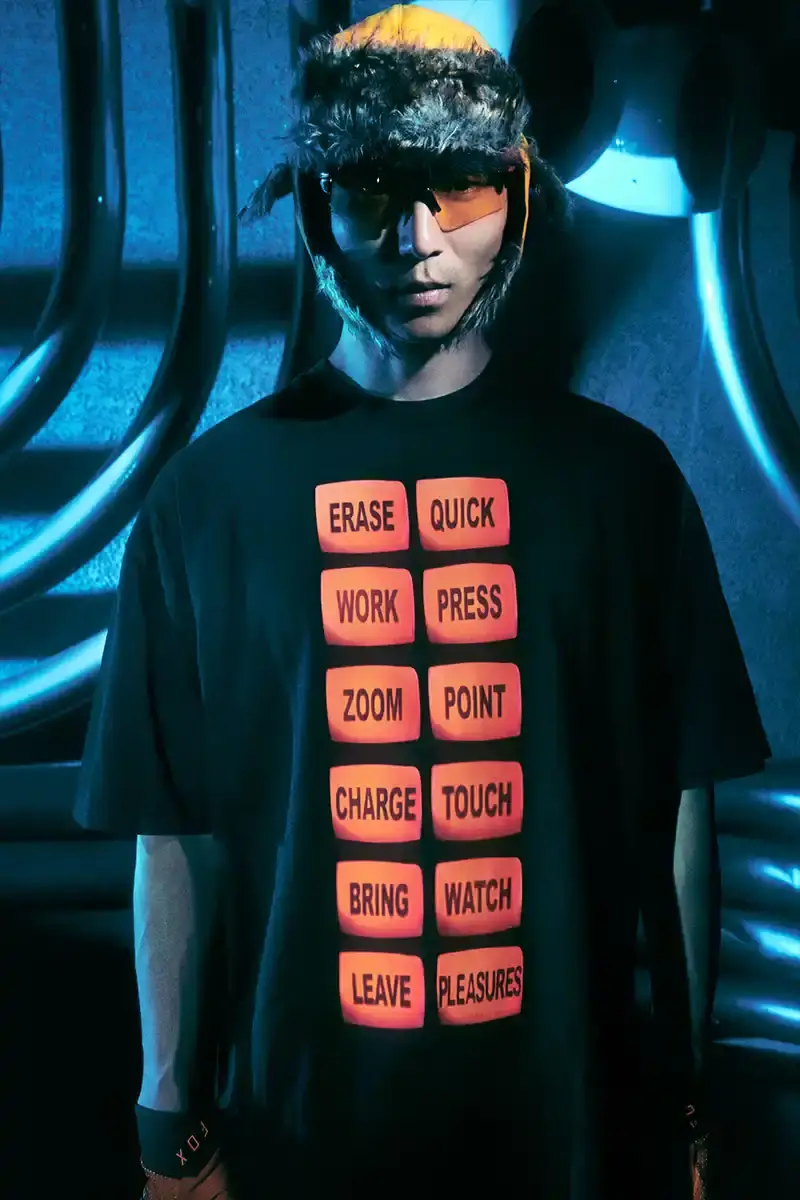 DAFT PUNK TEAMS UP WITH PLEASURES FOR NEW CAPSULE image about fashion collaboration between electronic music duo Daft Punk and streetwear brand PLEASURES. Features clothing and accessories incorporating the musicians' robot helmet imagery, album artwork, and references to their music videos and films. Collection includes hoodies, jackets, jeans, and accessories available July 16, 2025. (image 7 of 28)
