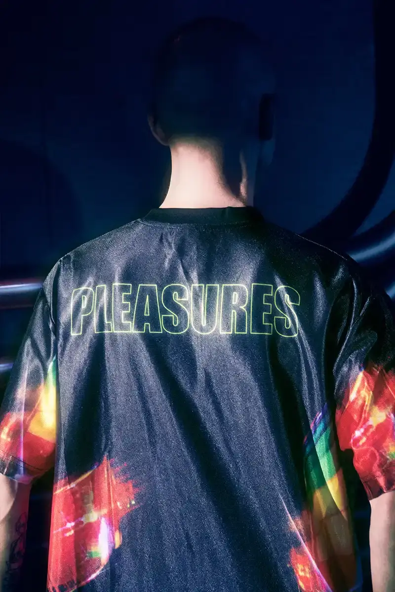 DAFT PUNK TEAMS UP WITH PLEASURES FOR NEW CAPSULE image about fashion collaboration between electronic music duo Daft Punk and streetwear brand PLEASURES. Features clothing and accessories incorporating the musicians' robot helmet imagery, album artwork, and references to their music videos and films. Collection includes hoodies, jackets, jeans, and accessories available July 16, 2025. (image 22 of 28)