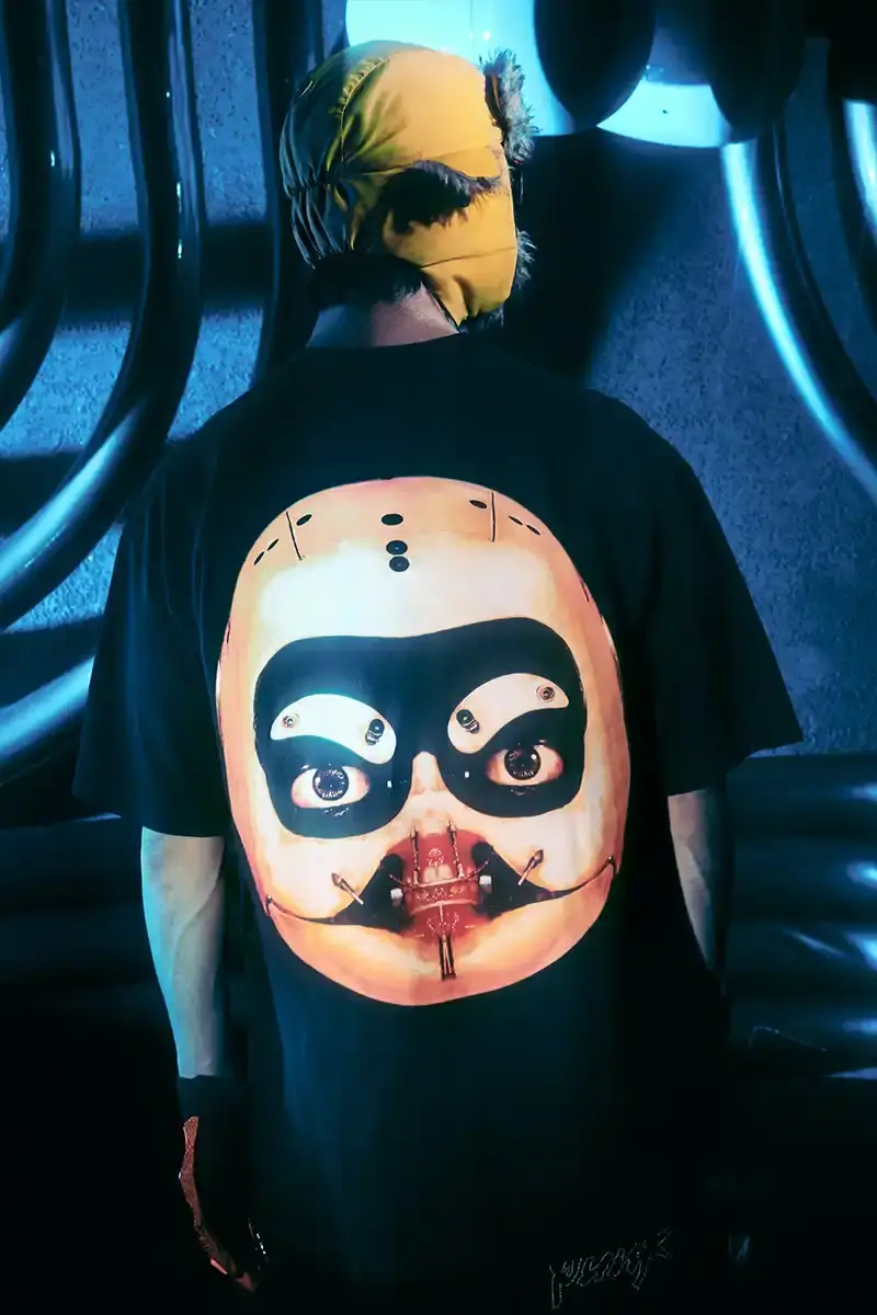 DAFT PUNK TEAMS UP WITH PLEASURES FOR NEW CAPSULE image about fashion collaboration between electronic music duo Daft Punk and streetwear brand PLEASURES. Features clothing and accessories incorporating the musicians' robot helmet imagery, album artwork, and references to their music videos and films. Collection includes hoodies, jackets, jeans, and accessories available July 16, 2025. (image 6 of 28)
