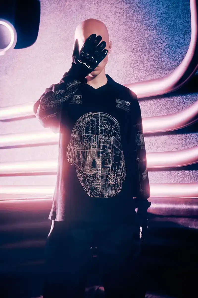 DAFT PUNK TEAMS UP WITH PLEASURES FOR NEW CAPSULE image about fashion collaboration between electronic music duo Daft Punk and streetwear brand PLEASURES. Features clothing and accessories incorporating the musicians' robot helmet imagery, album artwork, and references to their music videos and films. Collection includes hoodies, jackets, jeans, and accessories available July 16, 2025. (image 13 of 28)