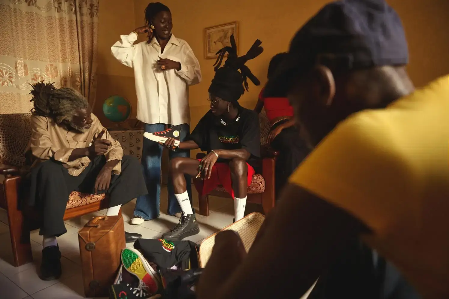 Models wearing Daily Paper x Converse collection against vibrant Senegalese backdrop, showcasing cultural connection between fashion and heritage