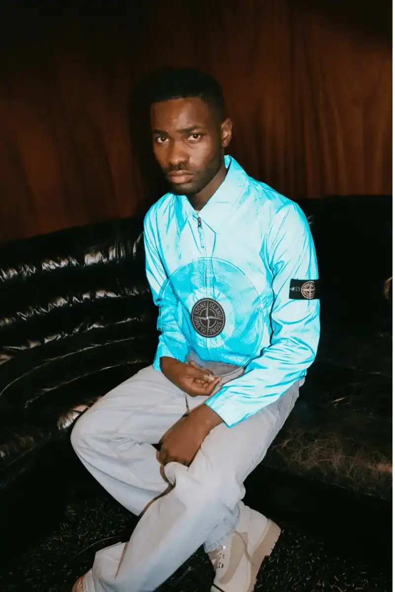 DAVE RELEASES THIRD STUDIO ALBUM WITH STONE ISLAND Dave's new album The Boy Who Played the Harp arrives October 24. Stone Island Sound creates accompanying short film featuring Dave's archive collection and releases limited vinyl at select stores. (image 7 of 10)