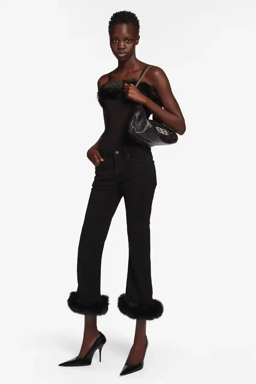 DEMNA PRESENTS FINAL READY-TO-WEAR AT BALENCIAGA image about fashion designer Demna's final ready-to-wear collection for Balenciaga. The Spring 2026 "Exactitudes" collection combines elements from his 35 previous shows during his ten-year tenure. During his leadership, Balenciaga's revenue grew from $400 million to $2 billion. The designer will present one final couture collection in July before departing the fashion house. (image 14 of 31)