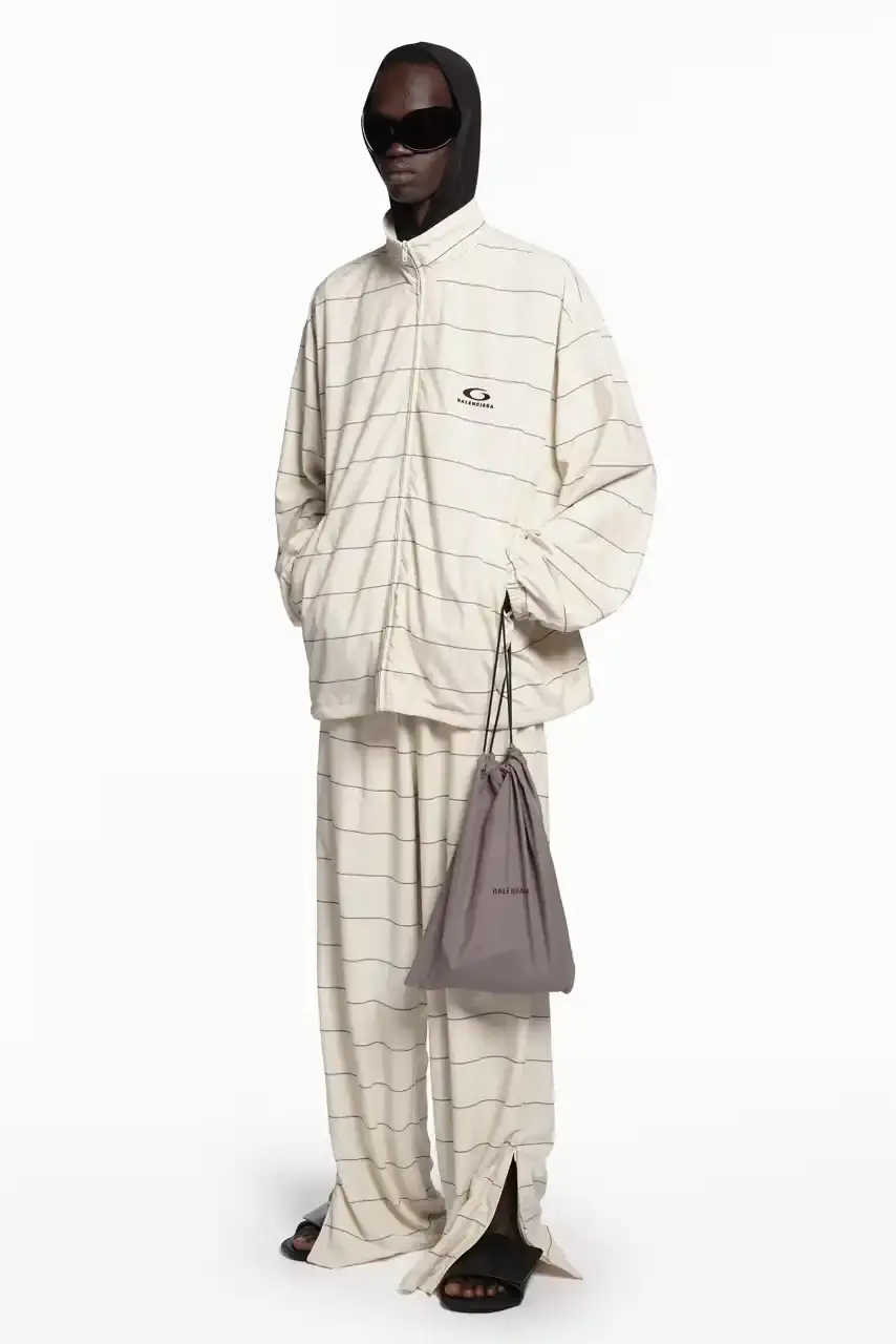 DEMNA PRESENTS FINAL READY-TO-WEAR AT BALENCIAGA image about fashion designer Demna's final ready-to-wear collection for Balenciaga. The Spring 2026 "Exactitudes" collection combines elements from his 35 previous shows during his ten-year tenure. During his leadership, Balenciaga's revenue grew from $400 million to $2 billion. The designer will present one final couture collection in July before departing the fashion house. (image 13 of 31)