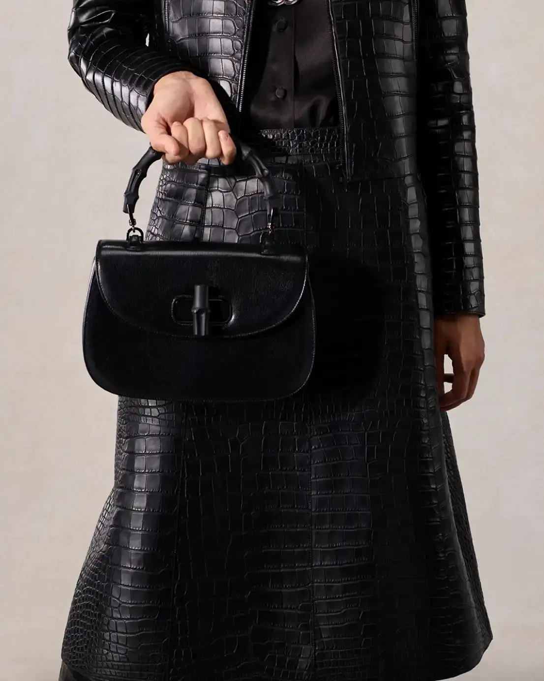 DEMNA PRESENTS LA FAMIGLIA FOR HIS FIRST GUCCI CAMPAIGN Fashion campaign images showing models in various Gucci outfits including gowns, boots, and accessories, photographed by Catherine Opie for Demna's first collection as creative director. (image 12 of 13)