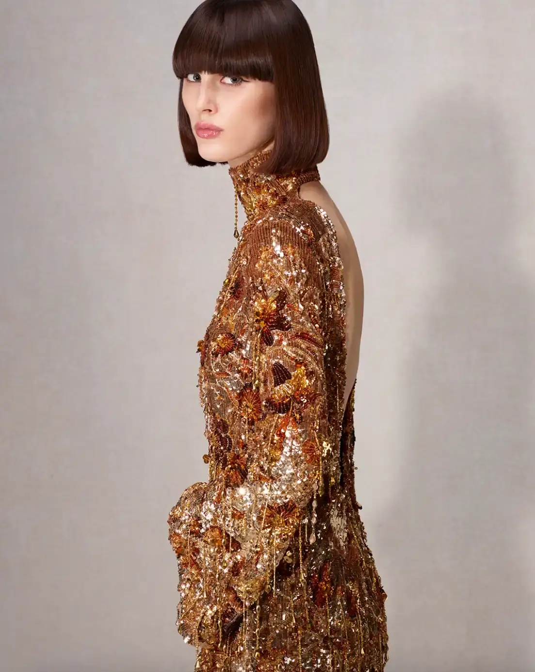 DEMNA PRESENTS LA FAMIGLIA FOR HIS FIRST GUCCI CAMPAIGN Fashion campaign images showing models in various Gucci outfits including gowns, boots, and accessories, photographed by Catherine Opie for Demna's first collection as creative director. (image 9 of 13)
