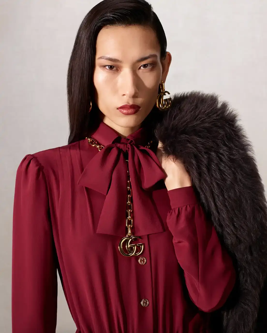 DEMNA PRESENTS LA FAMIGLIA FOR HIS FIRST GUCCI CAMPAIGN Fashion campaign images showing models in various Gucci outfits including gowns, boots, and accessories, photographed by Catherine Opie for Demna's first collection as creative director. (image 10 of 13)