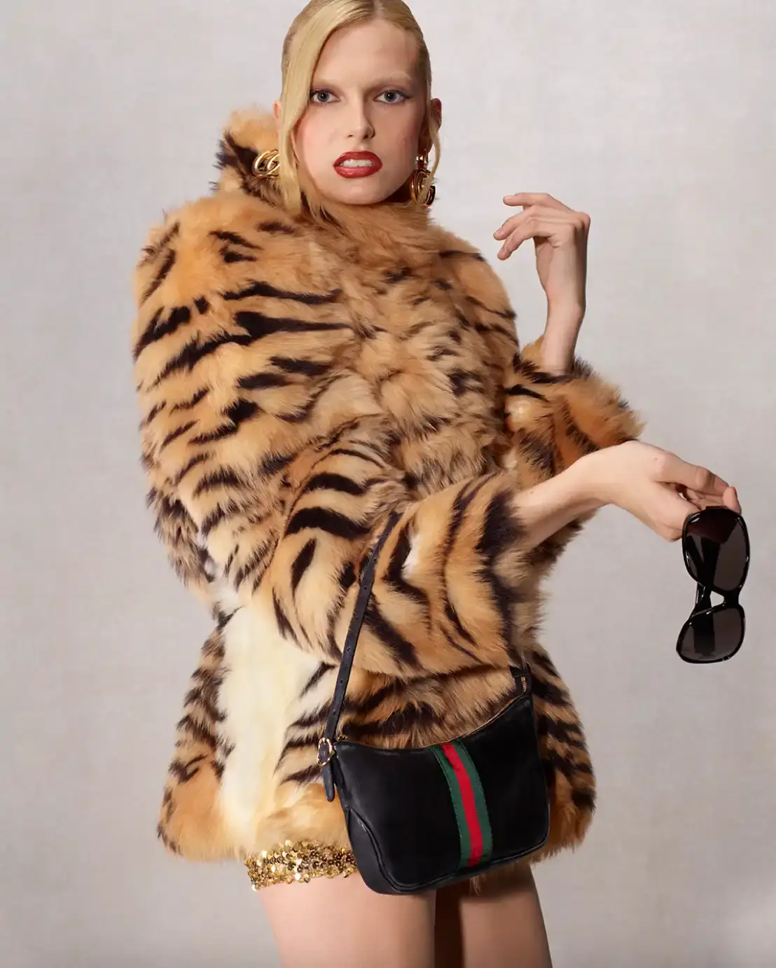DEMNA PRESENTS LA FAMIGLIA FOR HIS FIRST GUCCI CAMPAIGN Fashion campaign images showing models in various Gucci outfits including gowns, boots, and accessories, photographed by Catherine Opie for Demna's first collection as creative director.