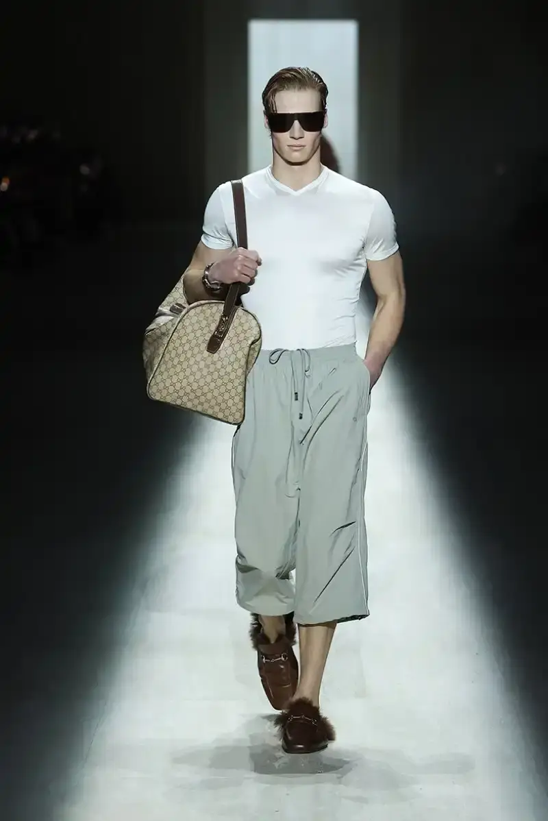 DEMNA'S FIRST GUCCI COLLECTION ARRIVES IN MILAN Demna Gvasalia's first Gucci collection runway show in Milan, featuring seamless garments, tracksuits, and the Manhattan sneaker. (image 20 of 32)