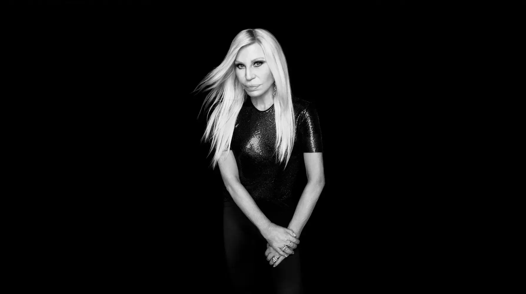 image announcement detailing Donatella Versace launching a beauty and fashion brand alongside Revolve Group.