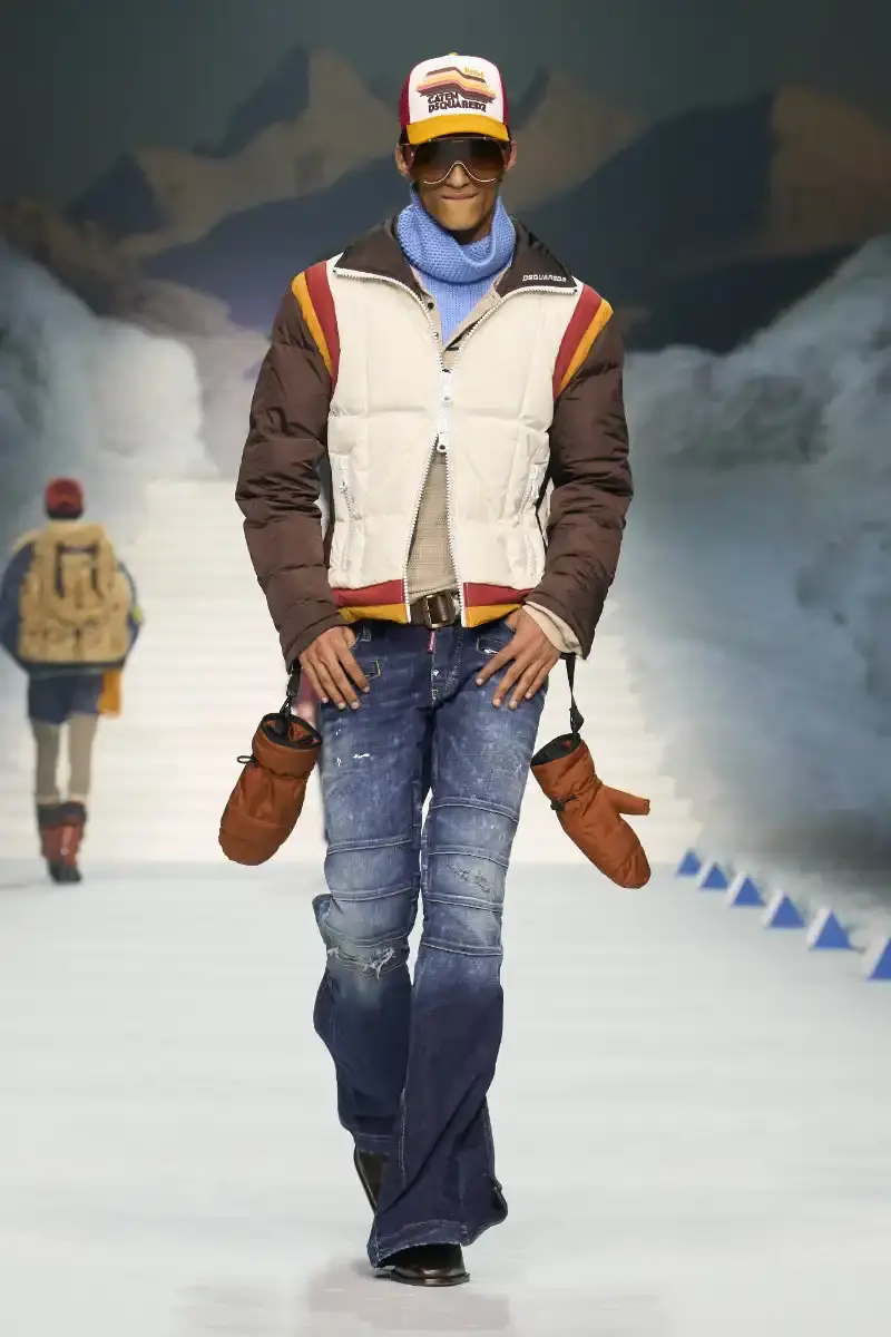 DSQUARED2 FALL/WINTER 2026 MENSWEAR DSQUARED2 Fall/Winter 2026 menswear collection at Milan Fashion Week features ski slope aesthetics, oversized puffers, technical sportswear, and Canadian-inspired designs with emphasis on layering and attitude. (image 6 of 14)