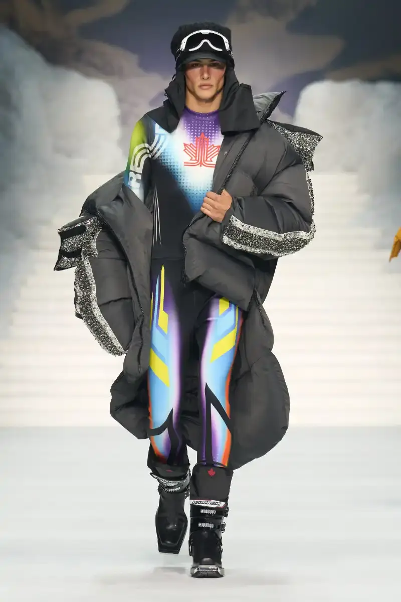 DSQUARED2 FALL/WINTER 2026 MENSWEAR DSQUARED2 Fall/Winter 2026 menswear collection at Milan Fashion Week features ski slope aesthetics, oversized puffers, technical sportswear, and Canadian-inspired designs with emphasis on layering and attitude. (image 2 of 14)