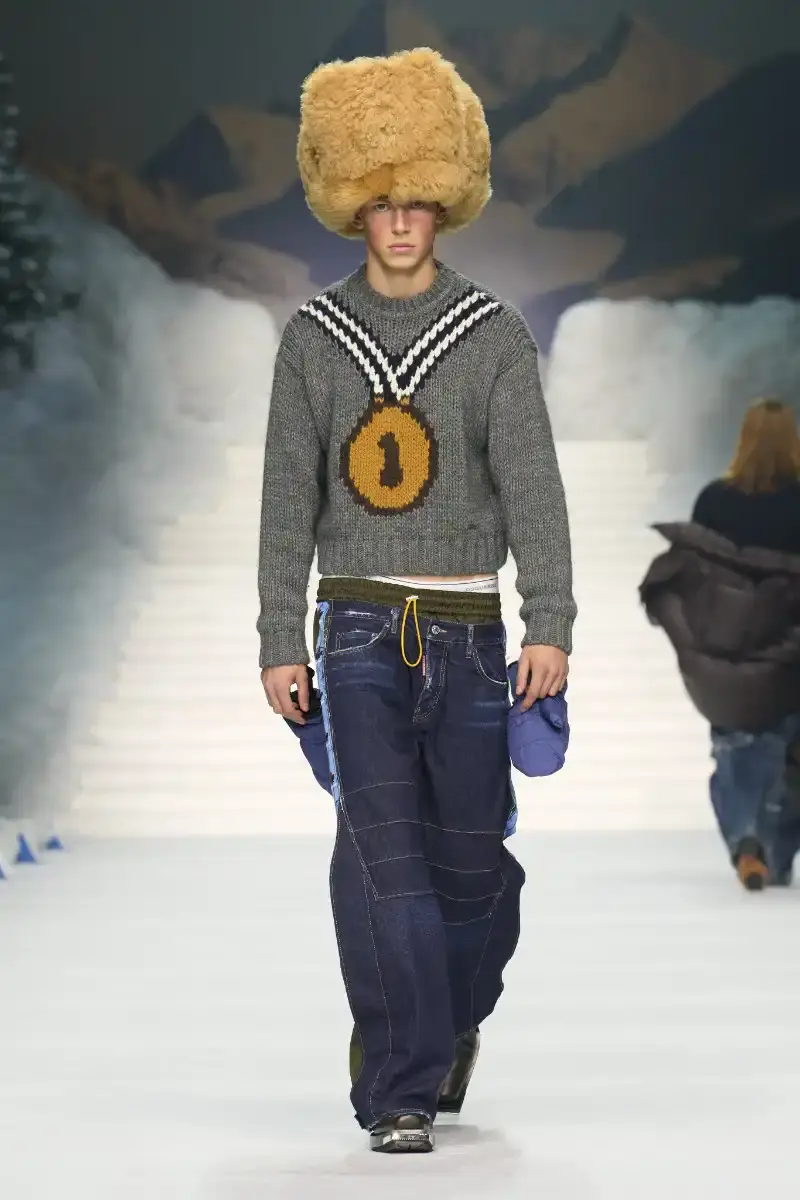 DSQUARED2 FALL/WINTER 2026 MENSWEAR DSQUARED2 Fall/Winter 2026 menswear collection at Milan Fashion Week features ski slope aesthetics, oversized puffers, technical sportswear, and Canadian-inspired designs with emphasis on layering and attitude. (image 4 of 14)