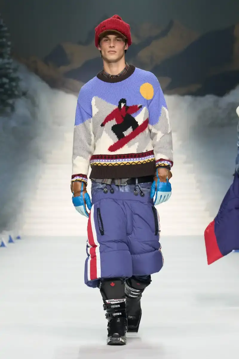 DSQUARED2 FALL/WINTER 2026 MENSWEAR DSQUARED2 Fall/Winter 2026 menswear collection at Milan Fashion Week features ski slope aesthetics, oversized puffers, technical sportswear, and Canadian-inspired designs with emphasis on layering and attitude. (image 12 of 14)