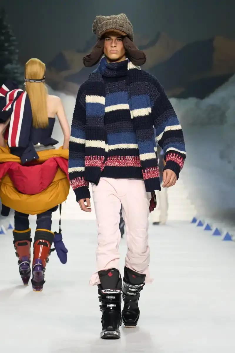 DSQUARED2 FALL/WINTER 2026 MENSWEAR DSQUARED2 Fall/Winter 2026 menswear collection at Milan Fashion Week features ski slope aesthetics, oversized puffers, technical sportswear, and Canadian-inspired designs with emphasis on layering and attitude. (image 11 of 14)