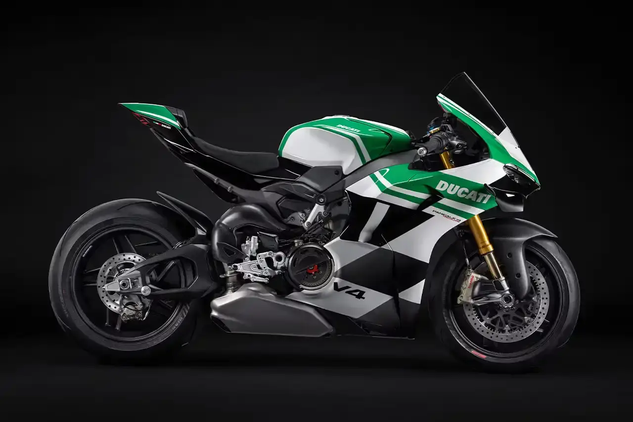 Ducati A side profile view of the Ducati Panigale V4 Tricolore motorcycle, showcasing its sleek racing design with asymmetrical Italian flag-inspired color scheme. The bike features carbon fiber rims, a racing-inspired silhouette, and a distinctive checkered flag motif, highlighting its special edition status and high-performance engineering. (image 4 of 7)