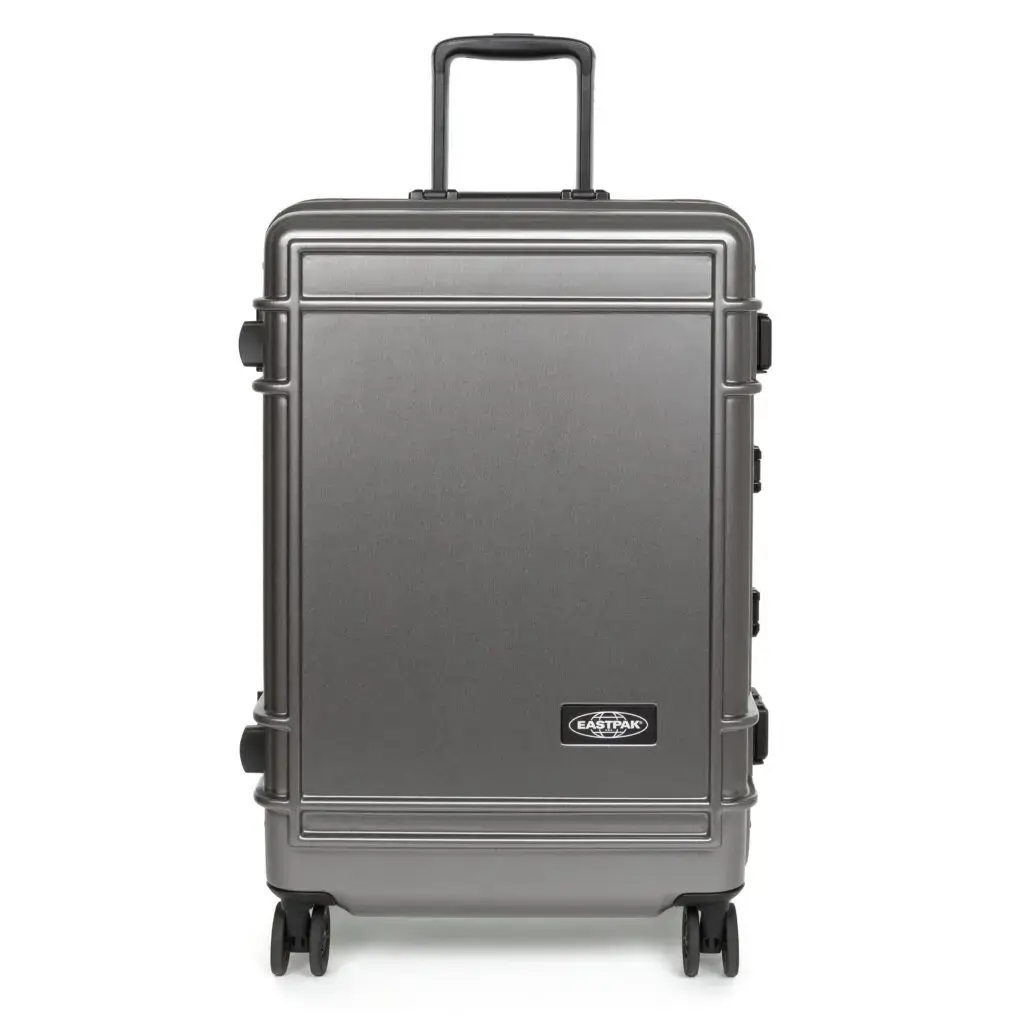Eastpak Resist'r Case hard-shell luggage in three sizes - small, medium, and large - displayed in red, gray, and black colors. The suitcases feature a sleek polycarbonate exterior with aluminum frame, quiet wheels, and TSA-approved locks. Eastpak logo visible on the front eastpak