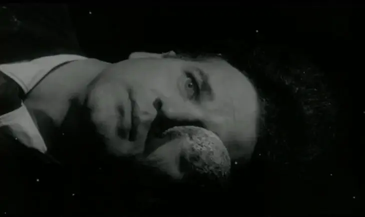 image analyzing the thematic similarities between a scene in the 1977 film Eraserhead and modern social media algorithms, focusing on human psychology.