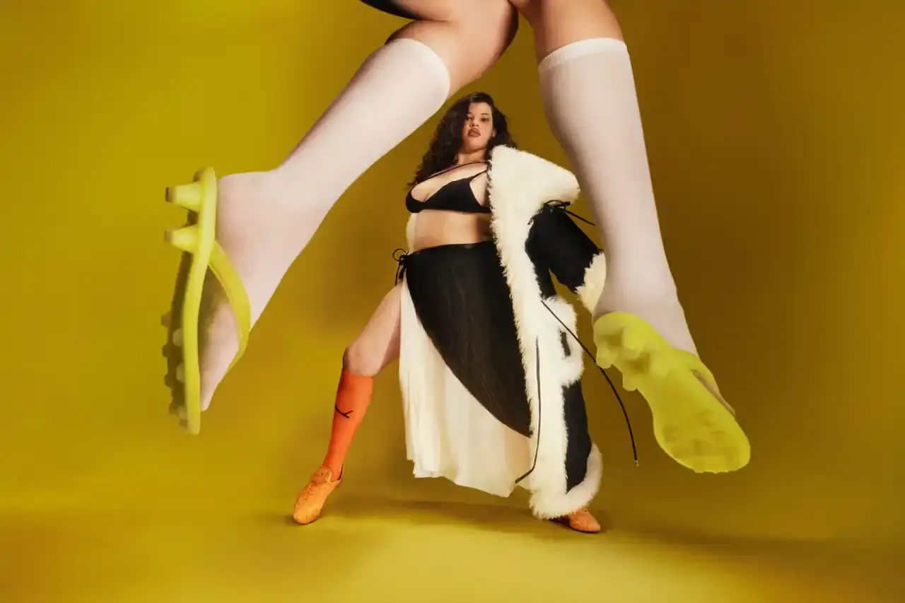 Puma FENTY x PUMA launches neon-colored Avanti LS sneakers, Cat Cleat Jelly slides, and Pocket Bags. Available worldwide March 13 in yellow and orange. (image 4 of 9)