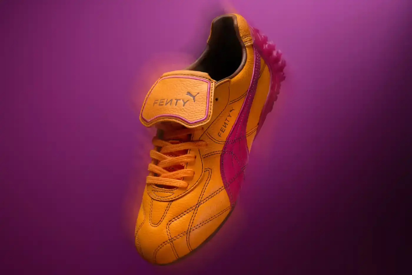 Puma FENTY x PUMA launches neon-colored Avanti LS sneakers, Cat Cleat Jelly slides, and Pocket Bags. Available worldwide March 13 in yellow and orange. (image 8 of 9)