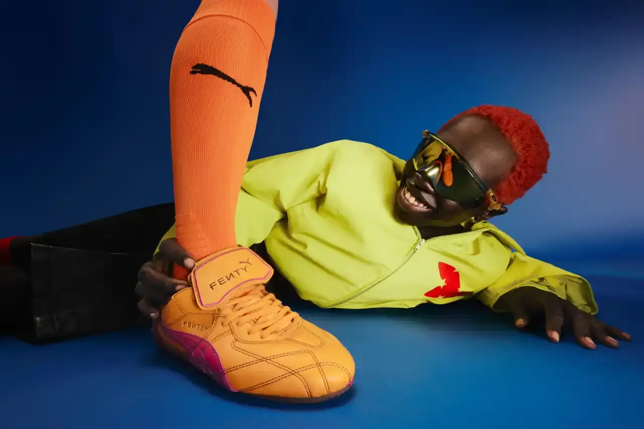 Puma FENTY x PUMA launches neon-colored Avanti LS sneakers, Cat Cleat Jelly slides, and Pocket Bags. Available worldwide March 13 in yellow and orange. (image 5 of 9)