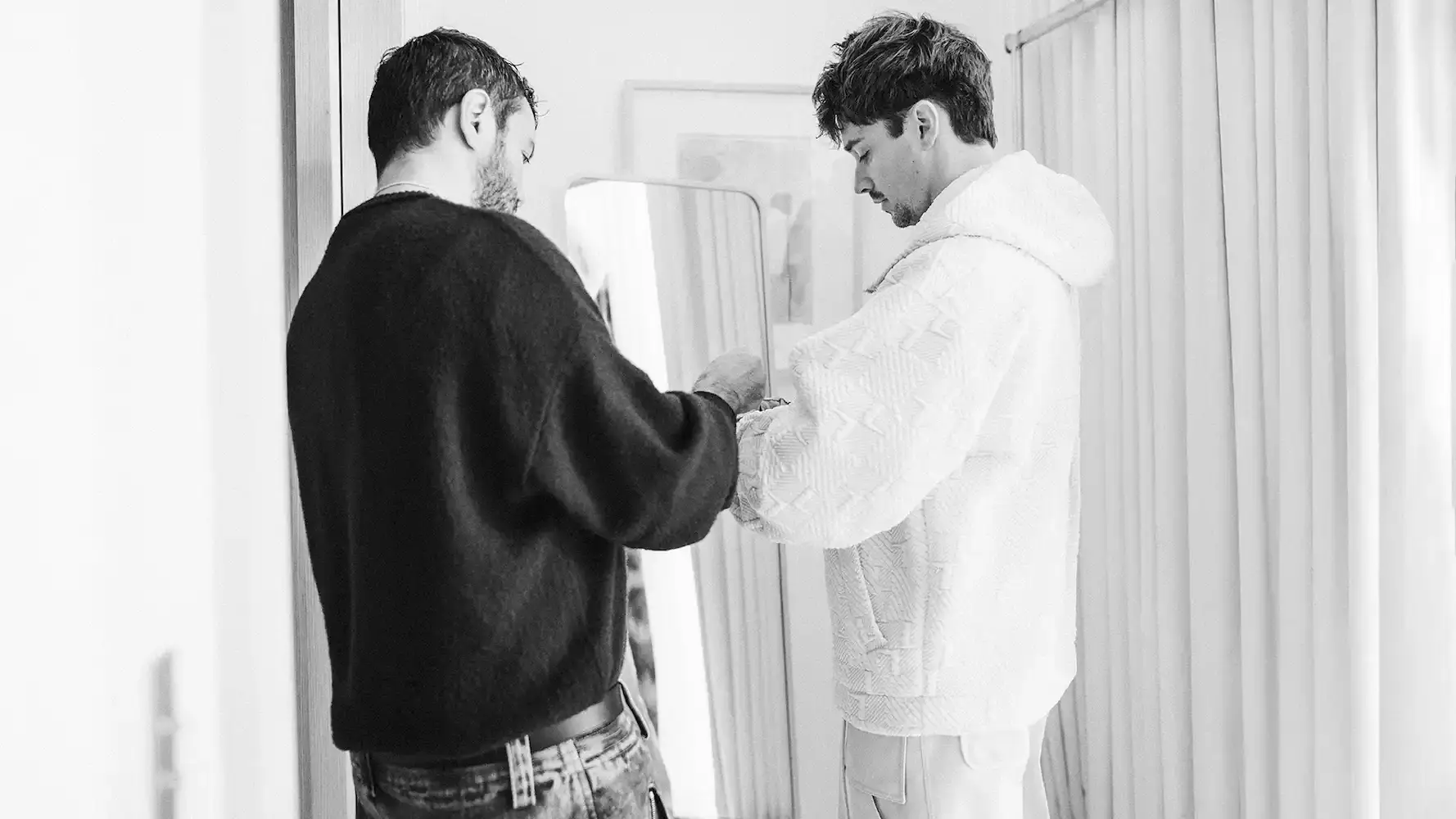 This article reports on Ferrari's announcement of a fashion collaboration with Formula 1 driver Charles Leclerc. It describes the upcoming limited edition capsule collection that combines Leclerc's personal style with Ferrari's design aesthetic. The article includes background on Leclerc's interest in fashion, quotes from a previous interview, details about Creative Director Rocco Iannone's involvement, and information about the May 21 launch event in Monte Carlo.