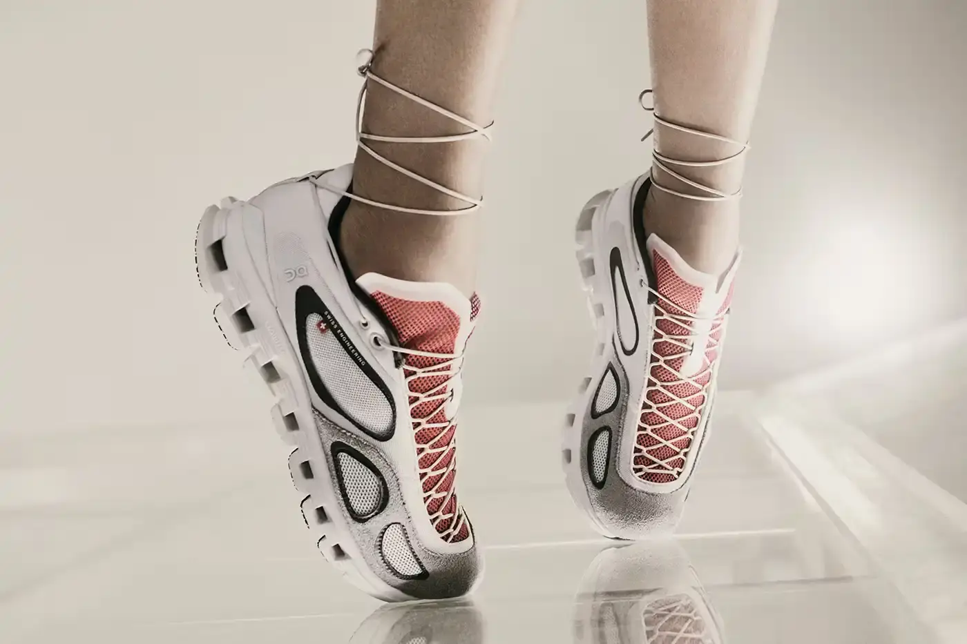 FKA TWIGS AND ON LAUNCH ATHLETIC COLLECTION image announces the launch of a new athletic wear collaboration between musician FKA twigs and sportswear brand On. The collection includes a dance-inspired sneaker called Cloud x FKA and various athletic apparel pieces in neutral colors. The article explains the design philosophy behind the collaboration, focusing on versatility for people with active, varied lifestyles. It includes quotes from FKA twigs about creating clothing that adapts to different daily activities, from training to meetings to studio work. The collection will be available for purchase starting June 26 through On's website. (image 6 of 6)