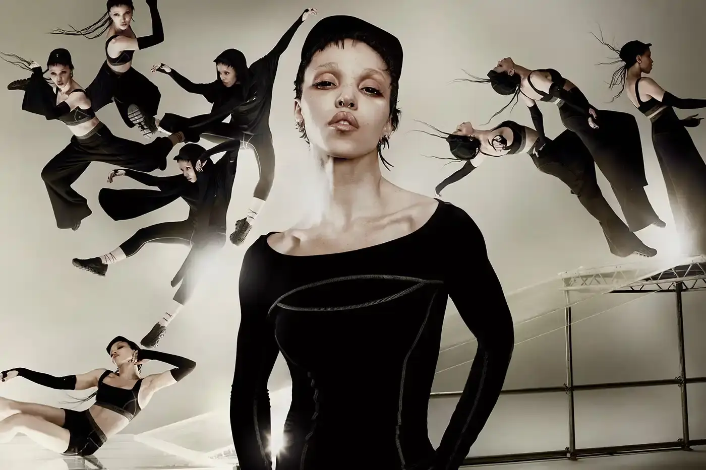 FKA TWIGS AND ON LAUNCH ATHLETIC COLLECTION image announces the launch of a new athletic wear collaboration between musician FKA twigs and sportswear brand On. The collection includes a dance-inspired sneaker called Cloud x FKA and various athletic apparel pieces in neutral colors. The article explains the design philosophy behind the collaboration, focusing on versatility for people with active, varied lifestyles. It includes quotes from FKA twigs about creating clothing that adapts to different daily activities, from training to meetings to studio work. The collection will be available for purchase starting June 26 through On's website. (image 5 of 6)