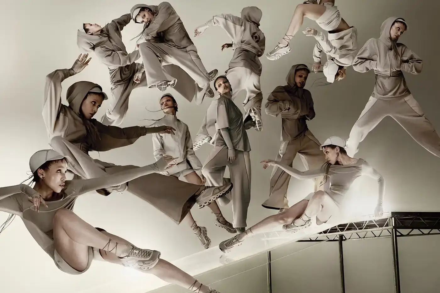 FKA TWIGS AND ON LAUNCH ATHLETIC COLLECTION image announces the launch of a new athletic wear collaboration between musician FKA twigs and sportswear brand On. The collection includes a dance-inspired sneaker called Cloud x FKA and various athletic apparel pieces in neutral colors. The article explains the design philosophy behind the collaboration, focusing on versatility for people with active, varied lifestyles. It includes quotes from FKA twigs about creating clothing that adapts to different daily activities, from training to meetings to studio work. The collection will be available for purchase starting June 26 through On's website.