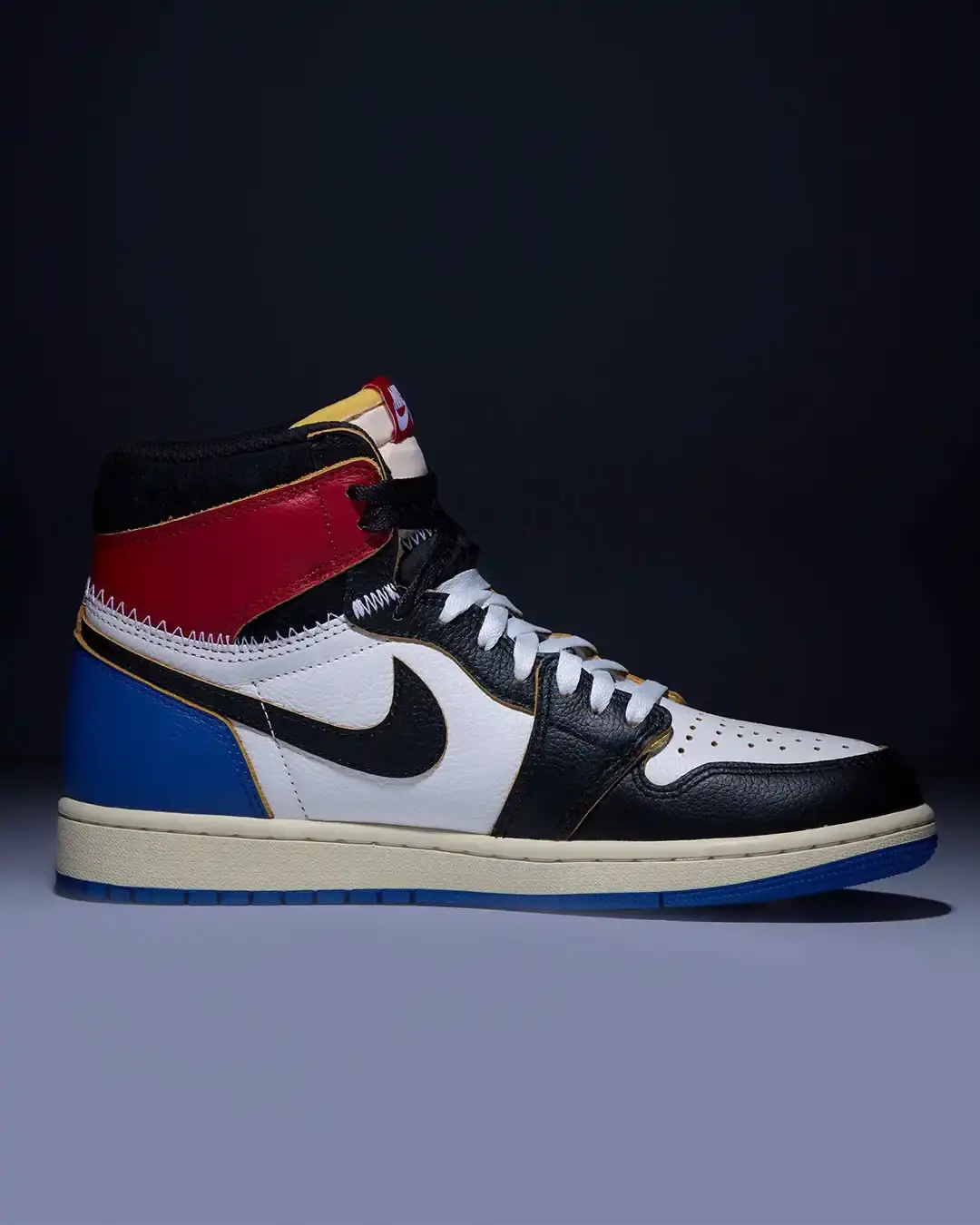 FRAGMENT UNION JORDAN 1 DROPS FEBRUARY 14 image about the Air Jordan 1 High collaboration between fragment design and Union Los Angeles, featuring deconstructed design elements and a hybrid colorway combining Black Toe and Sport Blue aesthetics, releasing February 14. (image 2 of 4)
