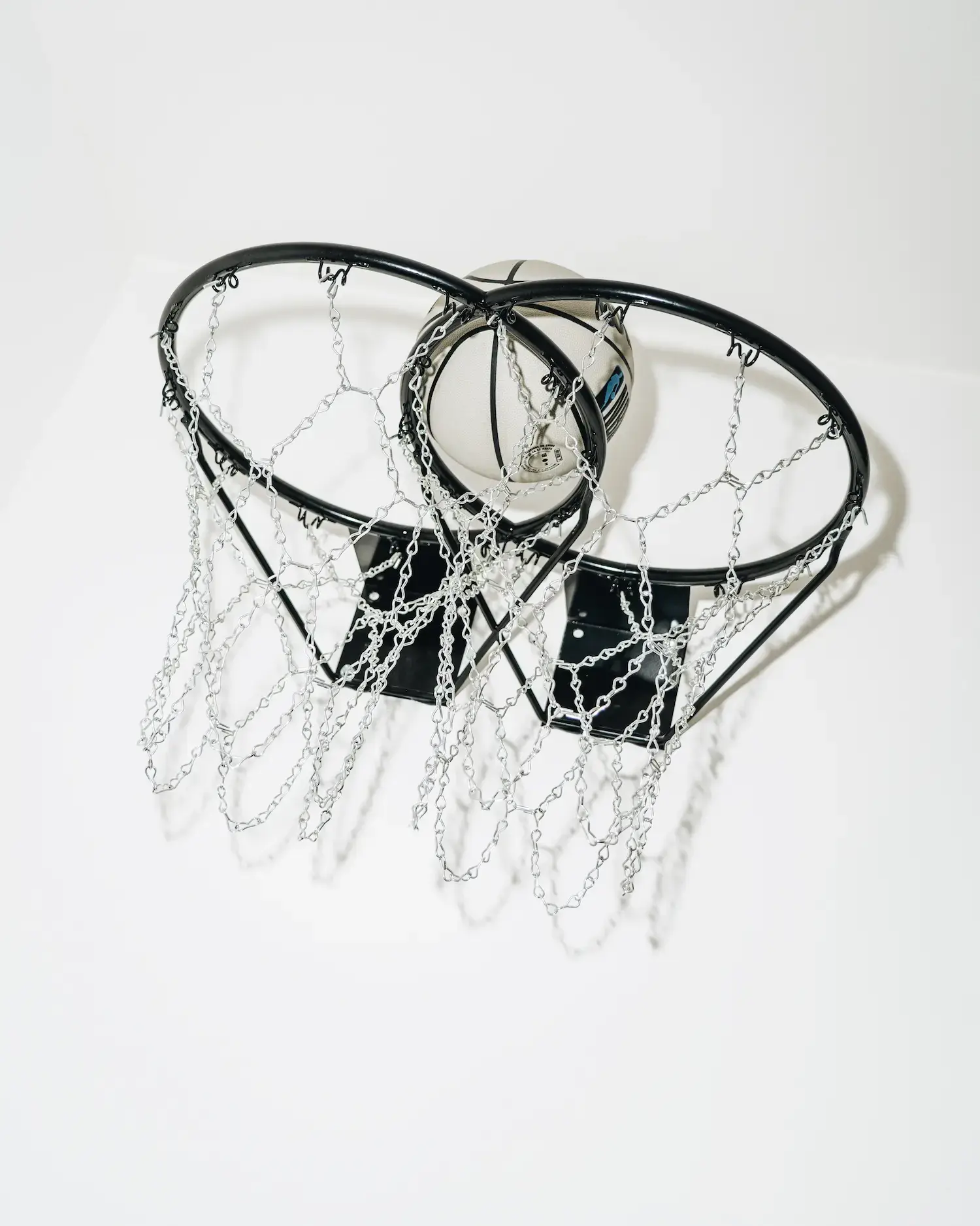 A surrealist basketball chess artwork by Francesco Vullo showing his Magritte-inspired approach to manipulating familiar objects in unexpected ways.