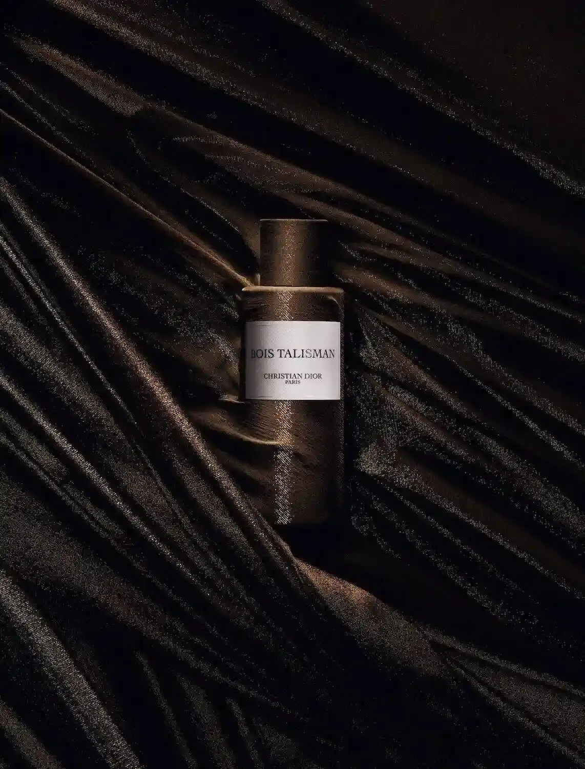 image of Francis Kurkdjian, the perfume creation director at Christian Dior Parfums, discussing his narrative-driven approach to fragrance development. The piece explores his latest creation, Bois Talisman, which draws inspiration from founder Christian Dior's personal superstitions and wooden talisman from the 1950s. The article covers Kurkdjian's background, his philosophy of storytelling in perfumery, and his technical process of combining cedarwood and vanilla notes. It also details his career trajectory from creating Le Male for Jean Paul Gaultier to his current role at Dior, where he balances updating classic fragrances with developing new additions to the house's collection. (image 3 of 3)
