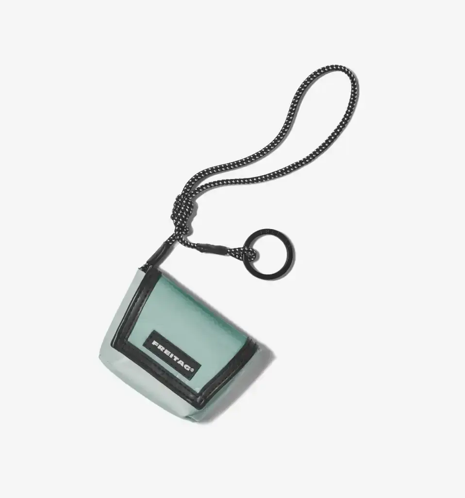 FREITAG TRANSFORMS PRODUCTION WASTE INTO BAG CHARMS image about FREITAG's new Lucky Trucking Charms collection, which repurposes production waste from truck tarps into bag accessories and keychains. (image 8 of 9)