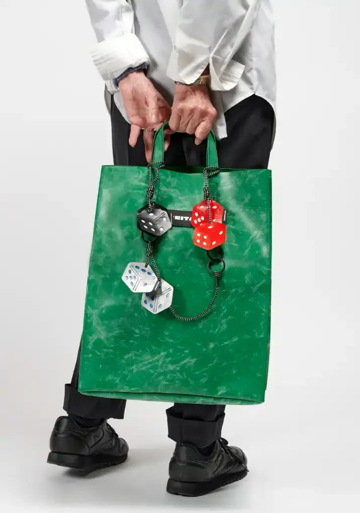 FREITAG TRANSFORMS PRODUCTION WASTE INTO BAG CHARMS image about FREITAG's new Lucky Trucking Charms collection, which repurposes production waste from truck tarps into bag accessories and keychains. (image 2 of 9)