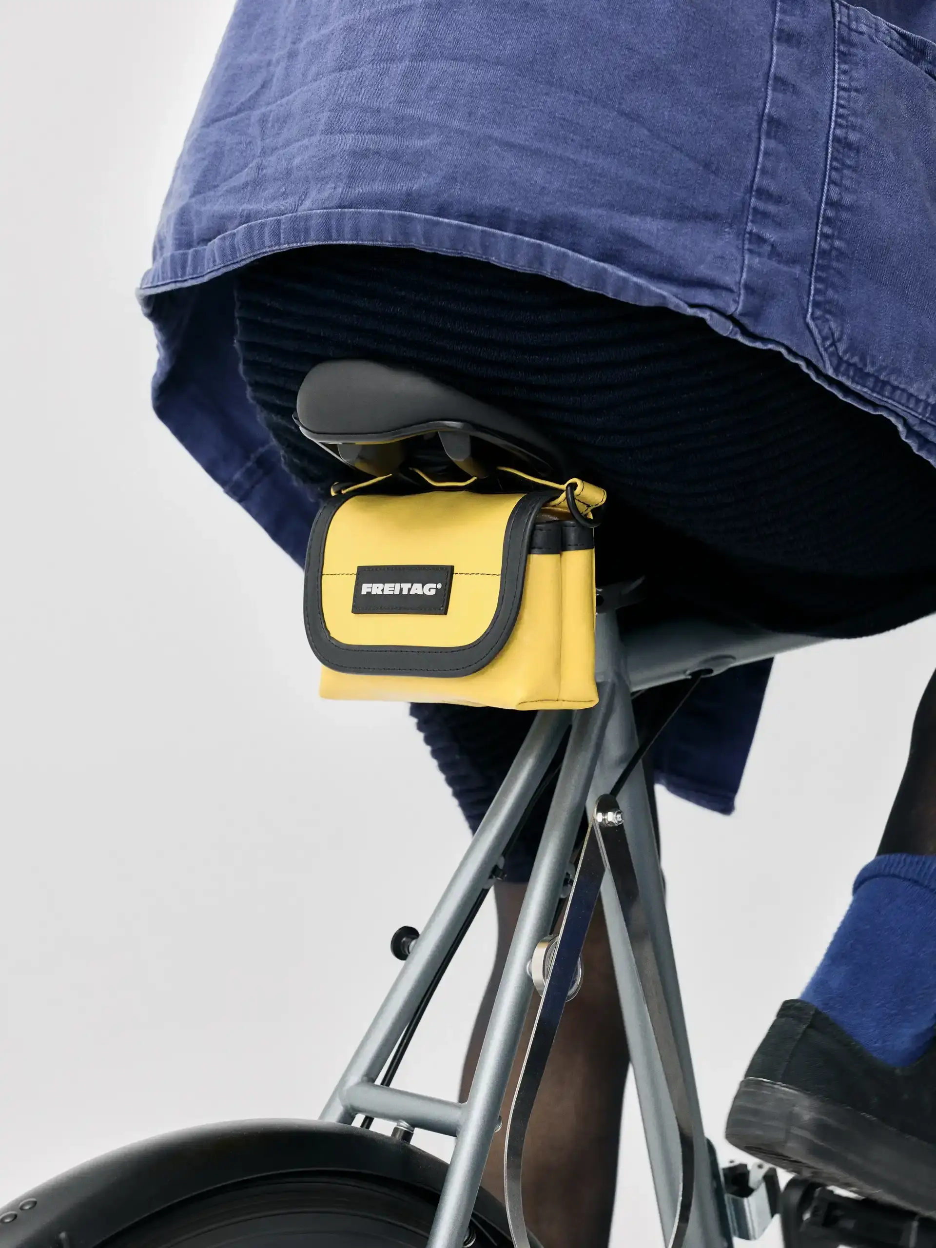 FREITAG RELEASES THREE NEW BICYCLE BAGS An image detailing three new Freitag bags designed for bicycles featuring recycled truck tarpaulins and reflective elements.