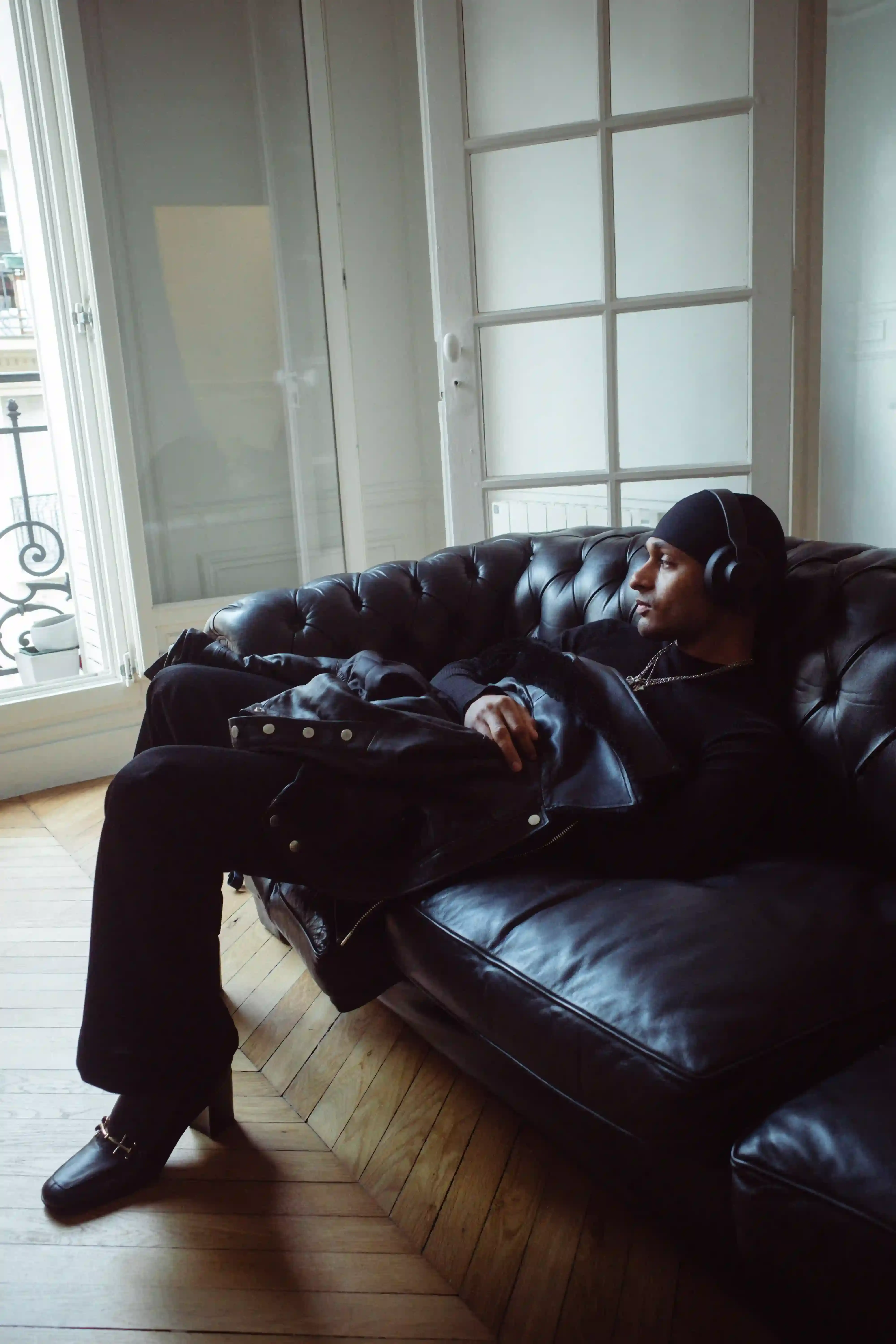 FROM YOUTUBE TO DJ AND PRODUCER: THE EVOLUTION OF ICYKOF icykof shoot & interview in Paris with casawi magazine, wearing leather jacket and On running beanie. photography by Lorenzo Bonanni (image 3 of 6)