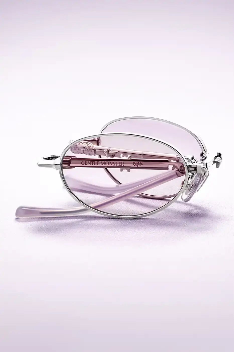 GENTLE MONSTER PARTNERS WITH BRATZ FOR POCKET EYEWEAR LINE image of th collaboration between eyewear manufacturer Gentle Monster and toy brand Bratz. The partnership produces a limited collection of 21 foldable sunglasses and optical frames with early 2000s design influences. The article covers product features, marketing campaign details featuring K-pop artist Karina, international pop-up store locations with specialty food partnerships, and release information scheduled for late May 2024. Content is presented in standard news article format with factual reporting on product specifications, availability, and promotional activities across four major cities. (image 5 of 9)