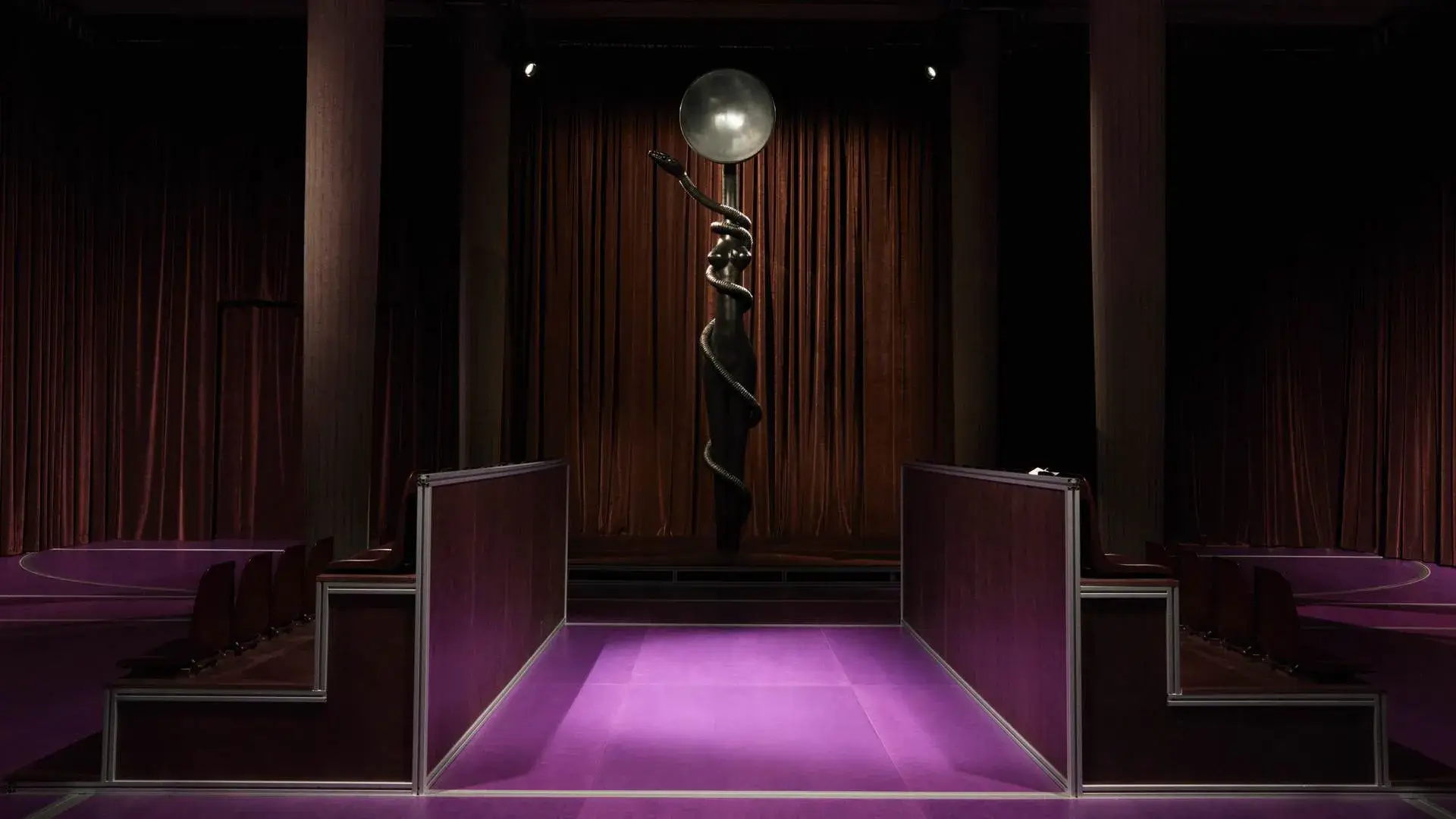 ALICE DIOP CURATES MIU MIU’S ART BASEL PARIS EXHIBITION image about Geste de Consolation, a free exhibition by filmmaker Alice Diop for Miu Miu at the Palais d’Iéna in Paris, open from October 21 to 25, 2026. The route has four spaces with film, photography, readings, dance, music and a bronze sculpture by Simone Leigh. (image 2 of 5)