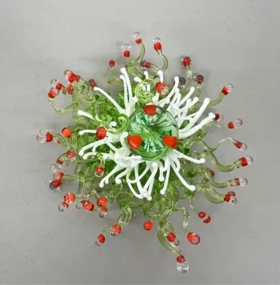 Lea Lenhart. Melts glass on a torch to create delicate, underwater-inspired glass ‘creatures’. Lea Lenhart. Melts glass on a torch to create delicate, underwater-inspired glass ‘creatures’.