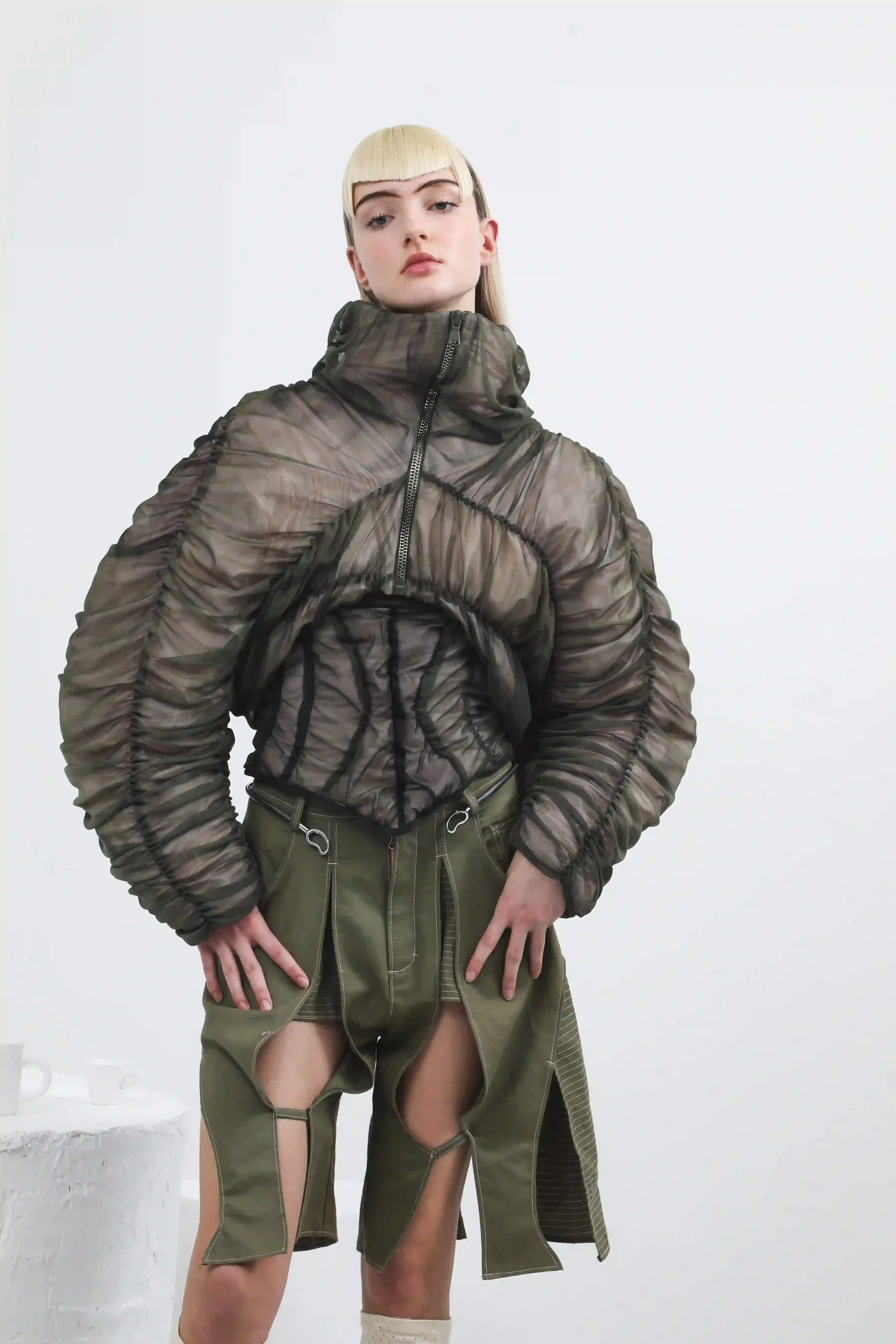 Antonio Giancaspro BERGIE's FW25 collection by Giorgiandreazza featuring sustainable Coffee Leather accessories made from recycled coffee grounds. The image shows the contrast between warm, traditional craftsmanship and innovative material technology in a luxury fashion context. (image 2 of 13)